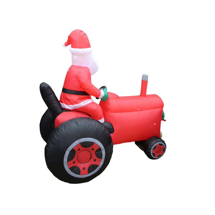 The Holiday Aisle® Santa on Tractor Inflatable Wayfair